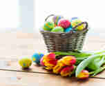 14641379 Close Up Of Easter Eggs In Basket And Flowers